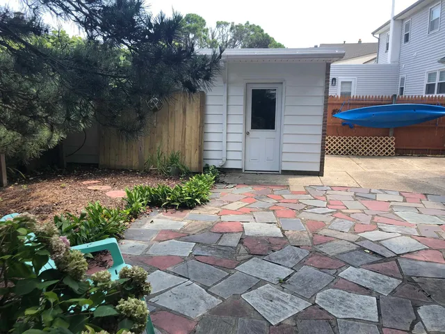 a view of a backyard of the house