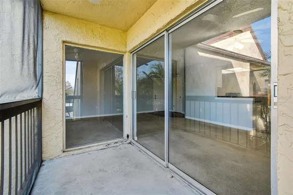 a kitchen with stainless steel appliances a refrigerator and a wooden floor
