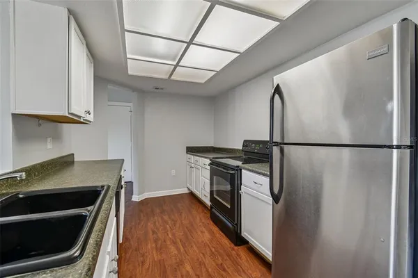 a kitchen with stainless steel appliances granite countertop a stove and a granite counter tops