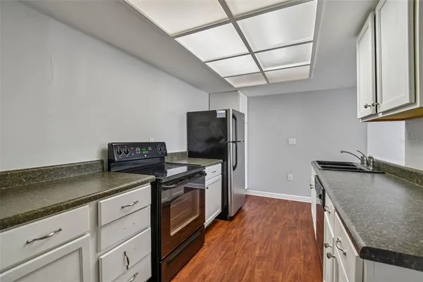 a kitchen with a sink and a stove