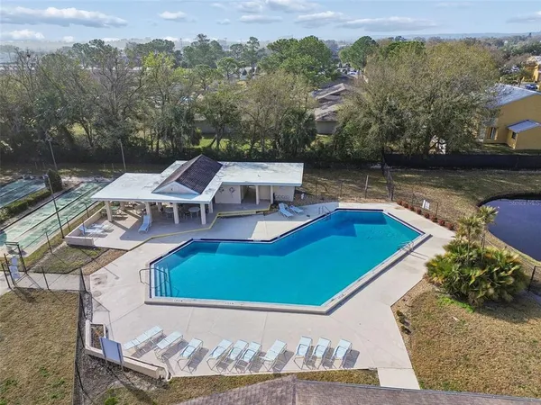 a view of a swimming pool with an outdoor seating