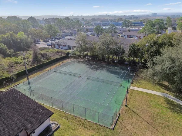 an aerial view of a city with ocean view