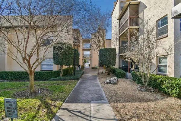 a view of a pathway both side of the house