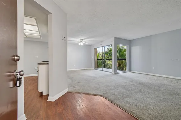 a view of an empty room with a window