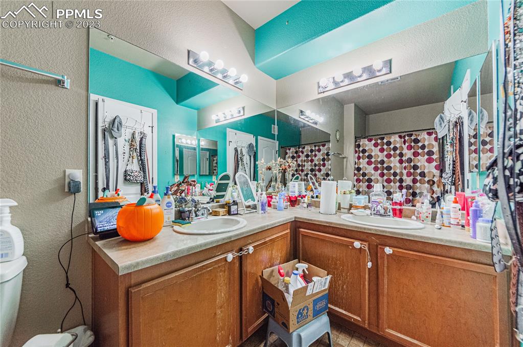 5354 Palomino Ranch Point, Unit 205 Colorado Springs, CO 80922 - Photo 11 of 26 a kitchen with a sink cabinets and appliances