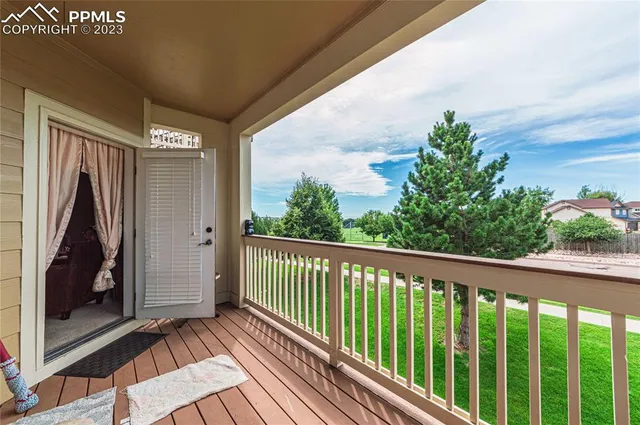 a view of a balcony with wooden floor