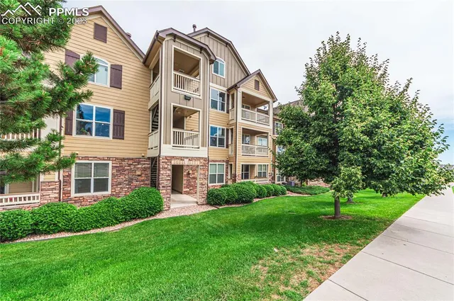 a view of a building with a yard