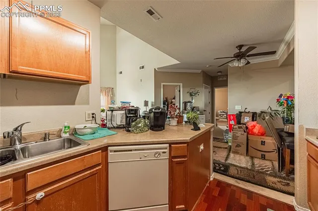 a kitchen with sink cabinets and utility