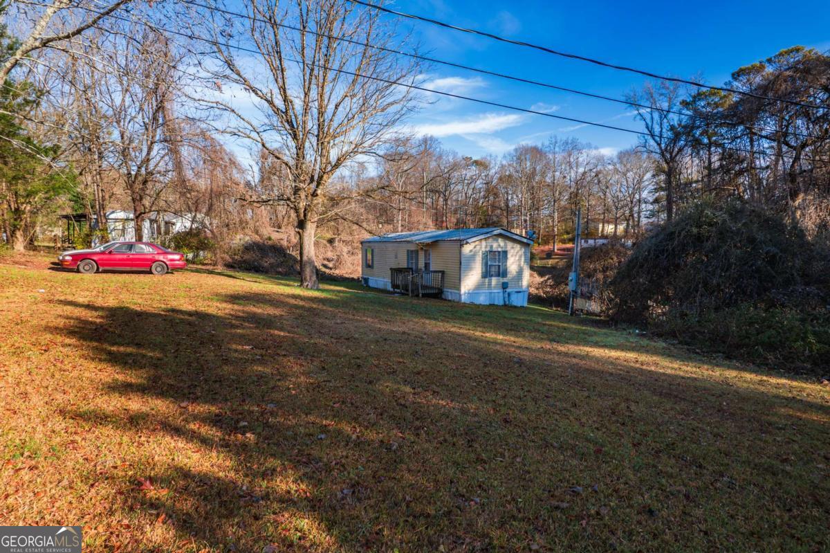 73 Lambert Street Jasper, GA 30143 - Photo 21 of 35 a view of street with large trees