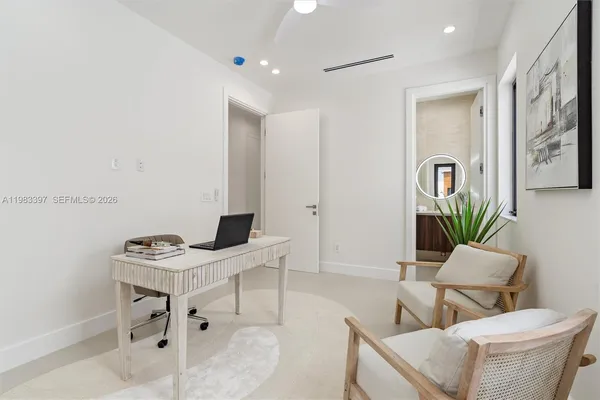 a work room with furniture and wooden floor