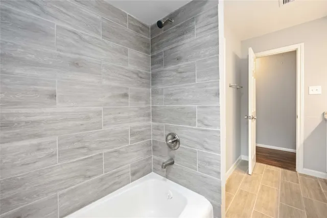 a bathroom with a sink and shower