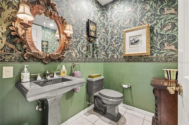 a bedroom with furniture and a chandelier