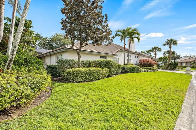 a living room with furniture ceiling fan and a rug