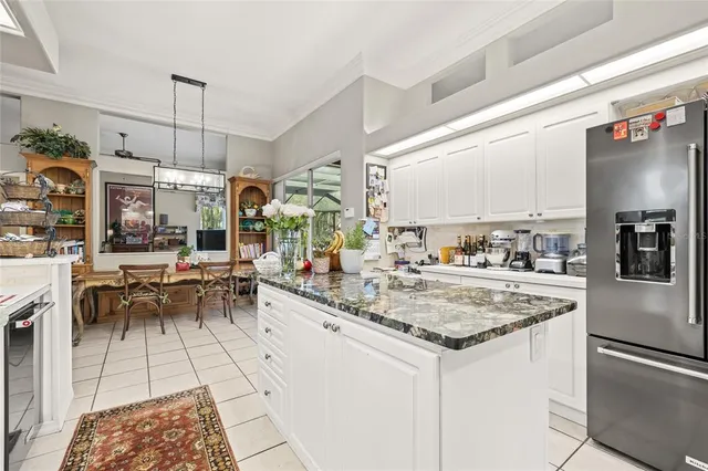 a bedroom with furniture and a fan