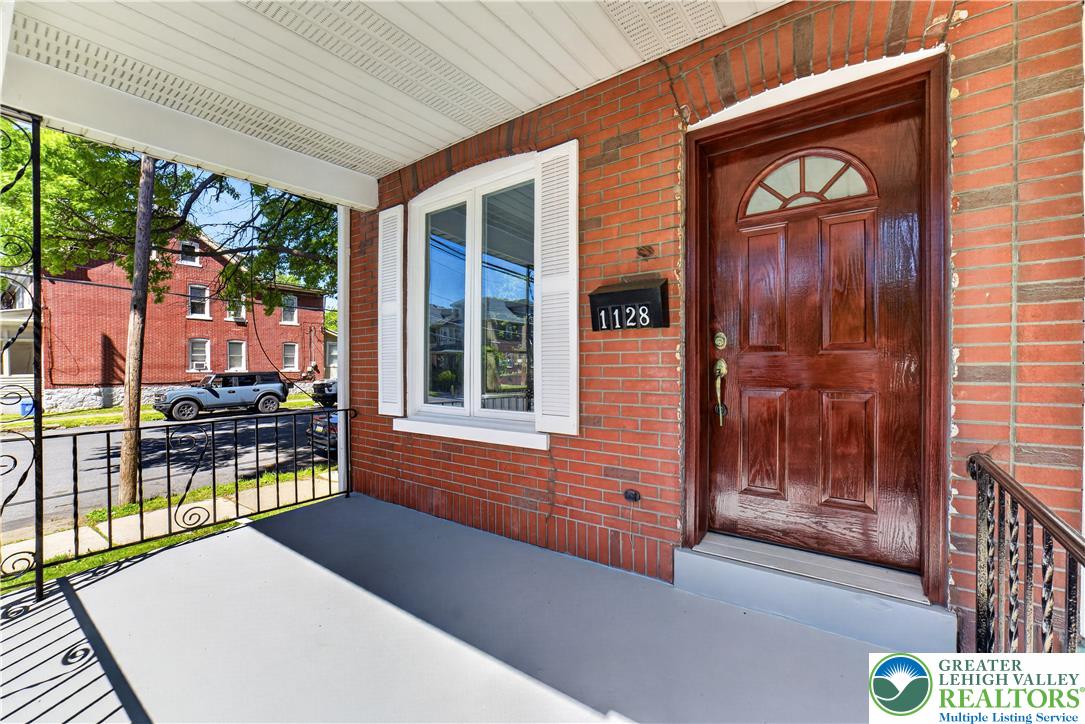1128 Maple Street Bethlehem, PA 18018 - Photo 4 of 34 A welcoming brick facade with a covered porch and classic detailing offers inviting curb appeal.