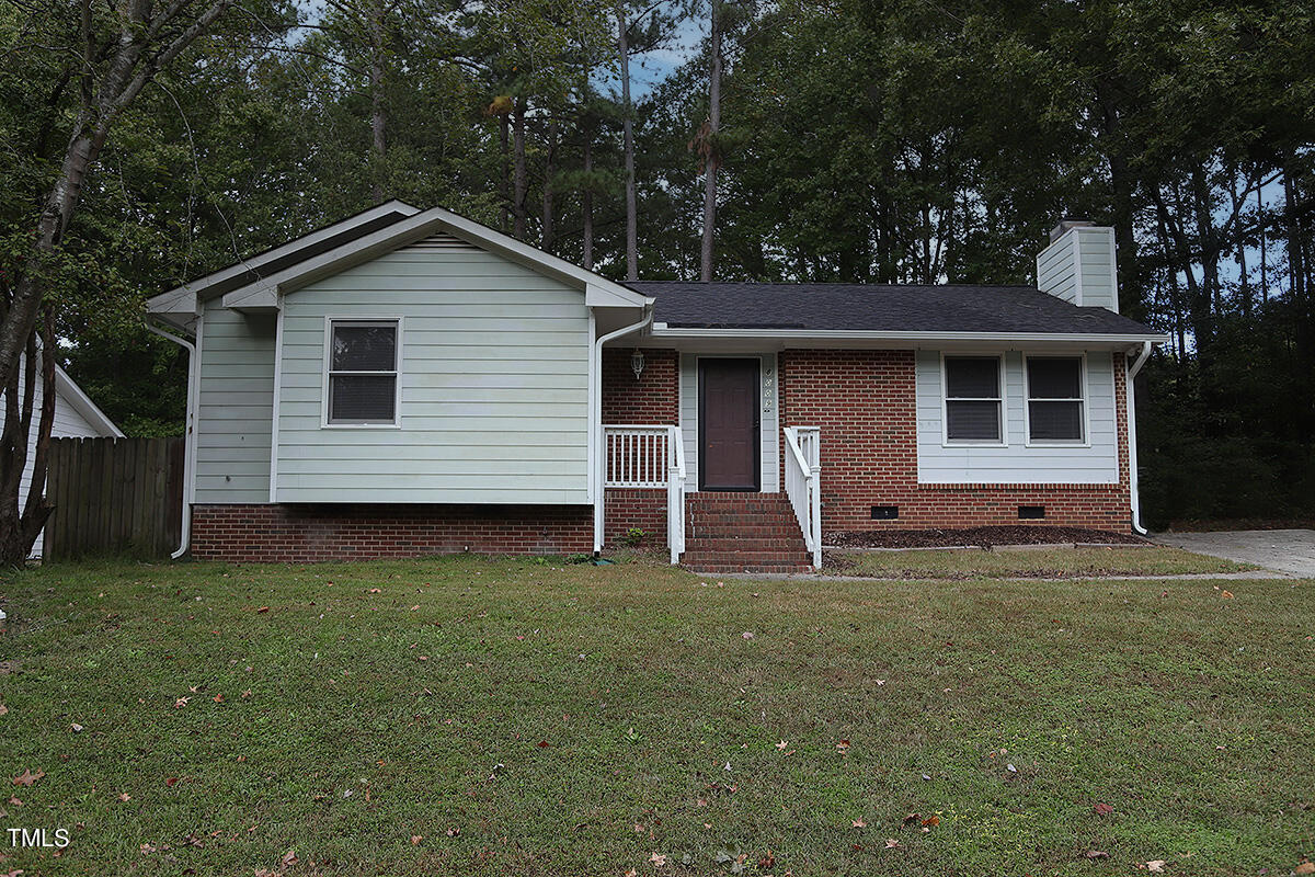 8009 Boxer Place Wake Forest, NC 27587 - Photo 1 of 11 a front view of a house with garden
