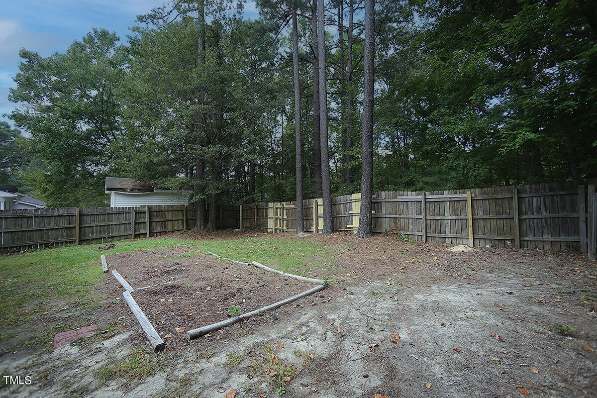 8009 Boxer Place Wake Forest, NC 27587 - Photo 11 of 11 a view of a yard with a tiny play house