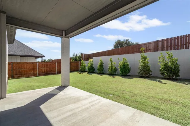 a view of a backyard of the house