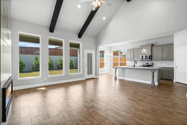 a view of kitchen with furniture and wooden floor
