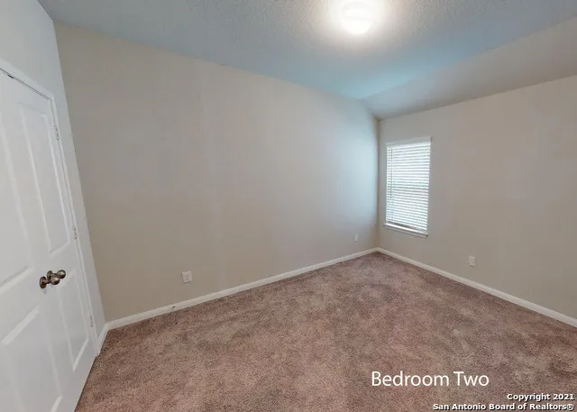 a view of an empty room and window