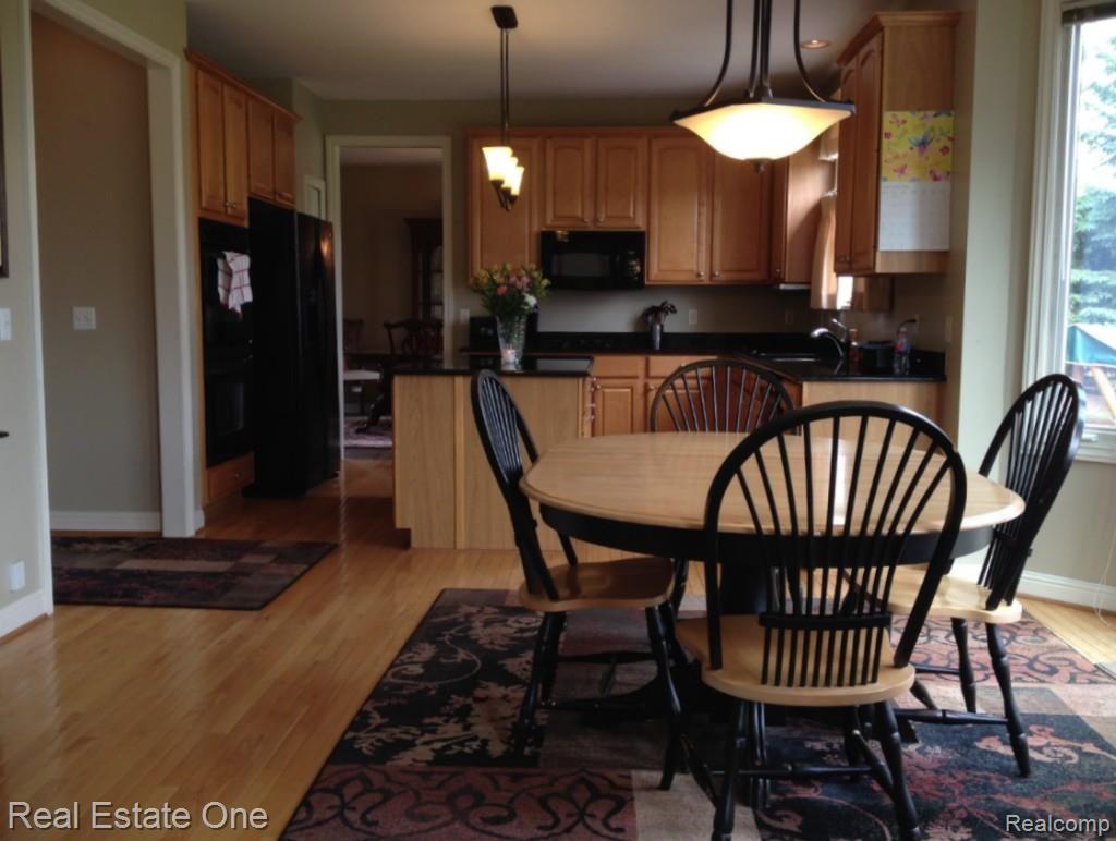 48005 Gladstone Road Canton, MI 48188 - Photo 13 of 62 Plenty of eating and entertaining space in this lovely kitchen; updated light fixtures