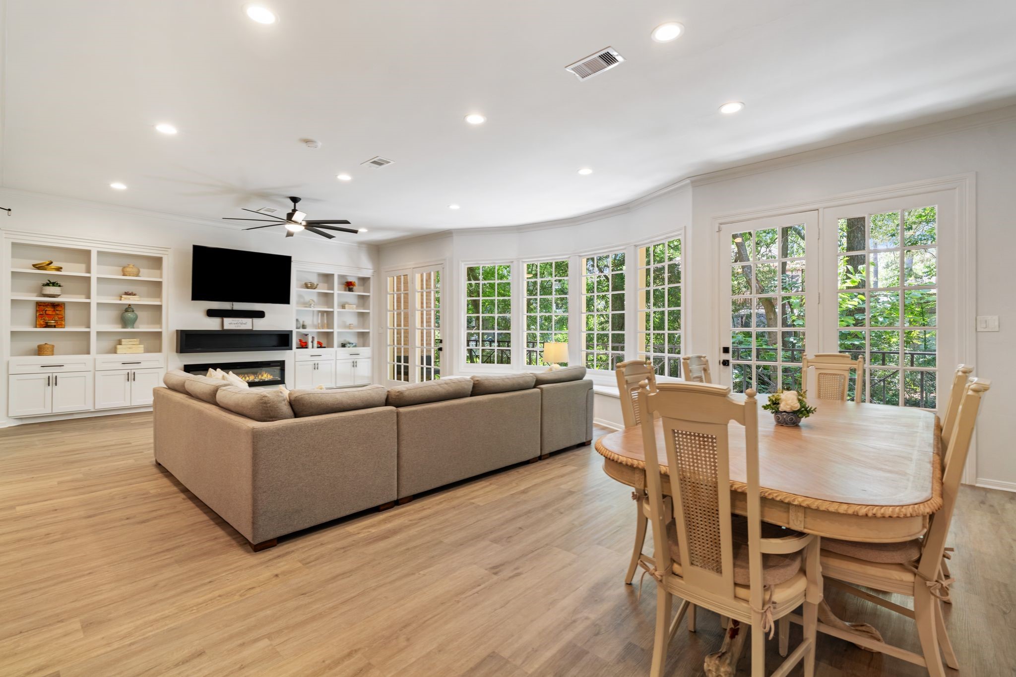 201 Vanderpool Lane, Unit 137 Houston, TX 77024 - Photo 11 of 42 The dining area sits within the open main living space, offering room to dine while still enjoying the surrounding treetop views and natural light from the nearby windows.