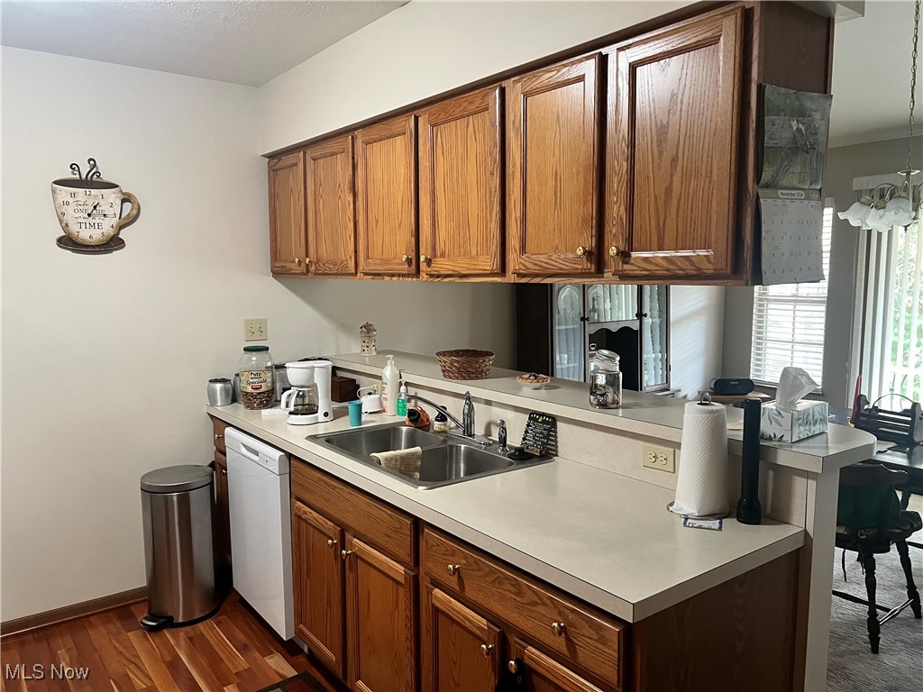 15372B Sprucevale Road East Liverpool, OH 43920 - Photo 2 of 14 Kitchen with white dishwasher, sink, and dark hardwood / wood-style flooring