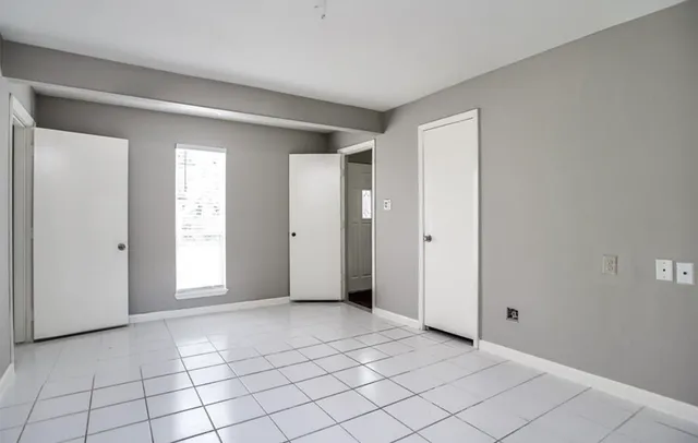 a view of an empty room and window