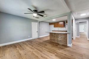 2238 Macon Street Dallas, TX 75215 - Photo 2 of 12 a view of an empty room with a fireplace and a window