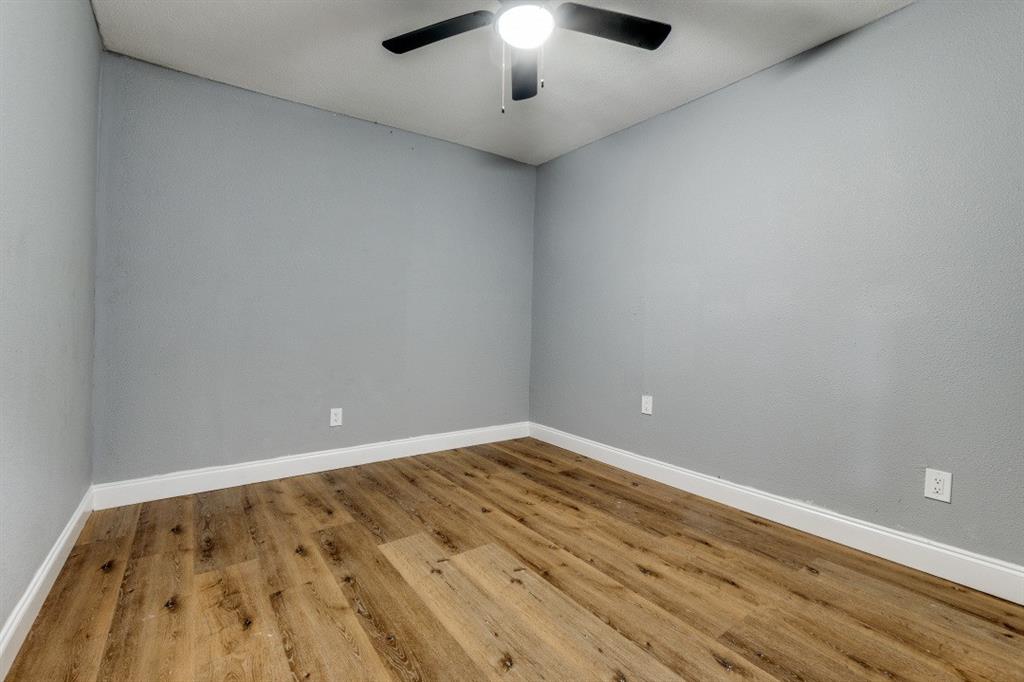 2238 Macon Street Dallas, TX 75215 - Photo 6 of 12 a view of an empty room and chandelier fan