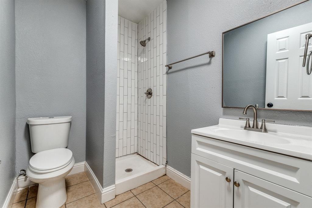 2238 Macon Street Dallas, TX 75215 - Photo 8 of 12 a bathroom with a sink a toilet and shower