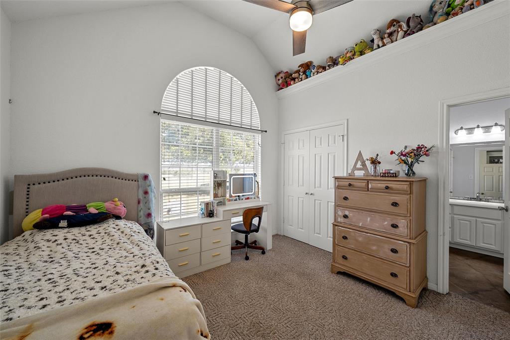 3696 Old Lorena Road Lorena, TX 76655 - Photo 19 of 27 Arched window with blinds, vaulted ceiling, and ceiling fan