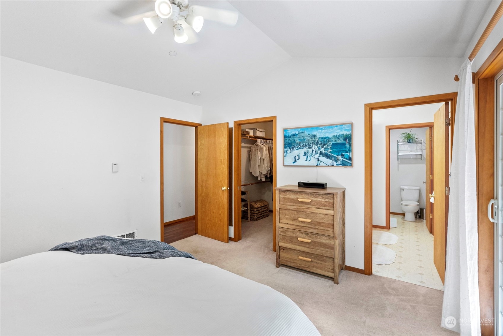 17410 Elhi Rim Road East Bonney Lake, WA 98391 - Photo 20 of 40 a bedroom with a bed and a dresser