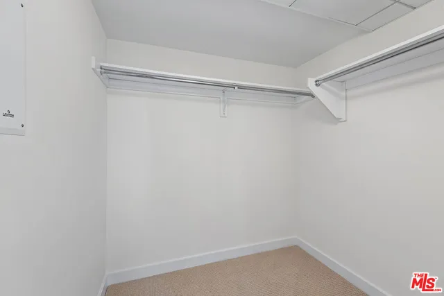 a view of an empty walk in closet