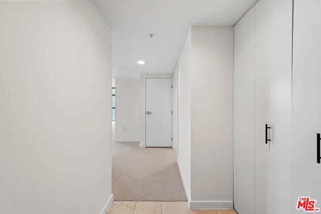 a view of a hall with chairs