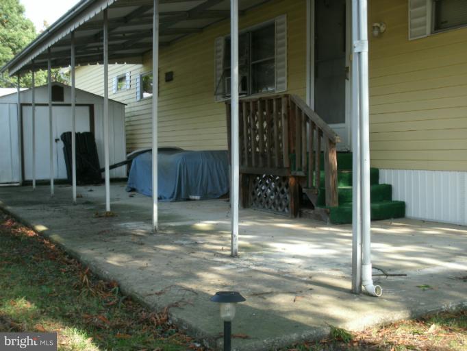 133 Trailway Road Middle River, MD 21220 - Photo 14 of 17 Shed, Concrete Patio & Rear Entry Stairs