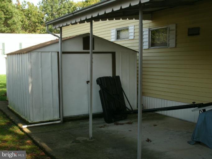 133 Trailway Road Middle River, MD 21220 - Photo 15 of 17 Large Storage Shed off Covered Concrete Patio