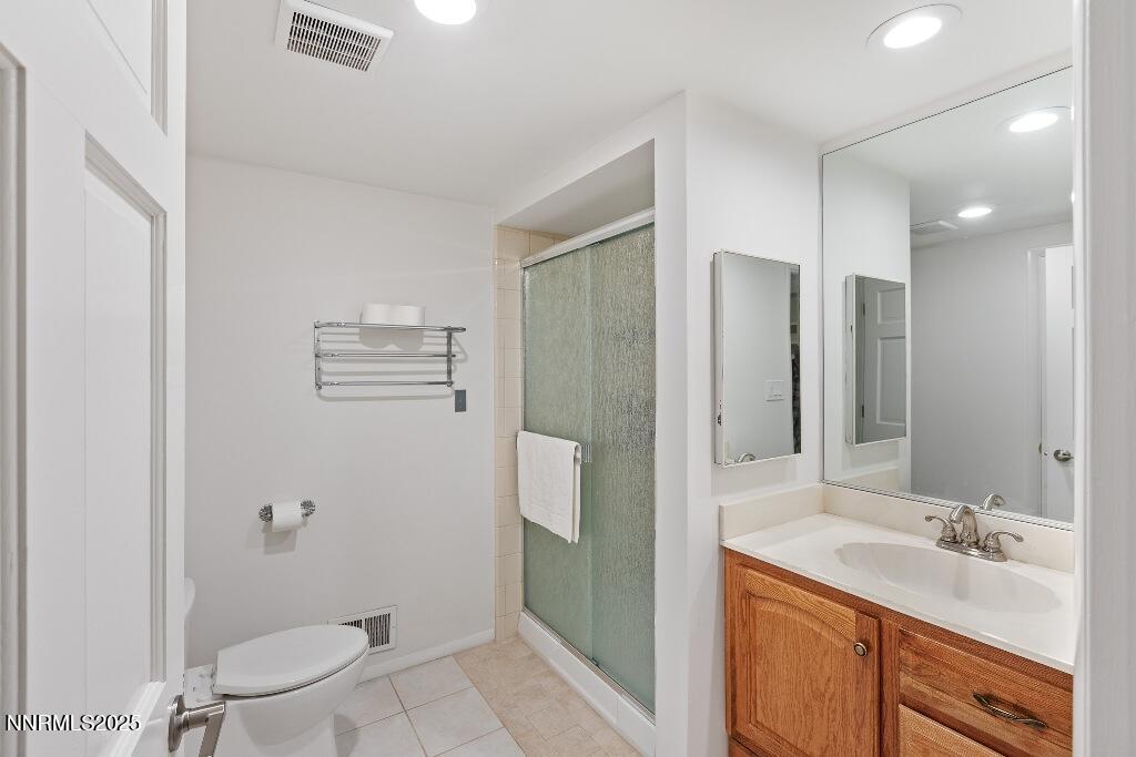 4811 Lakeridge Terrace West Reno, NV 89509 - Photo 39 of 43 a bathroom with a granite countertop sink toilet and shower