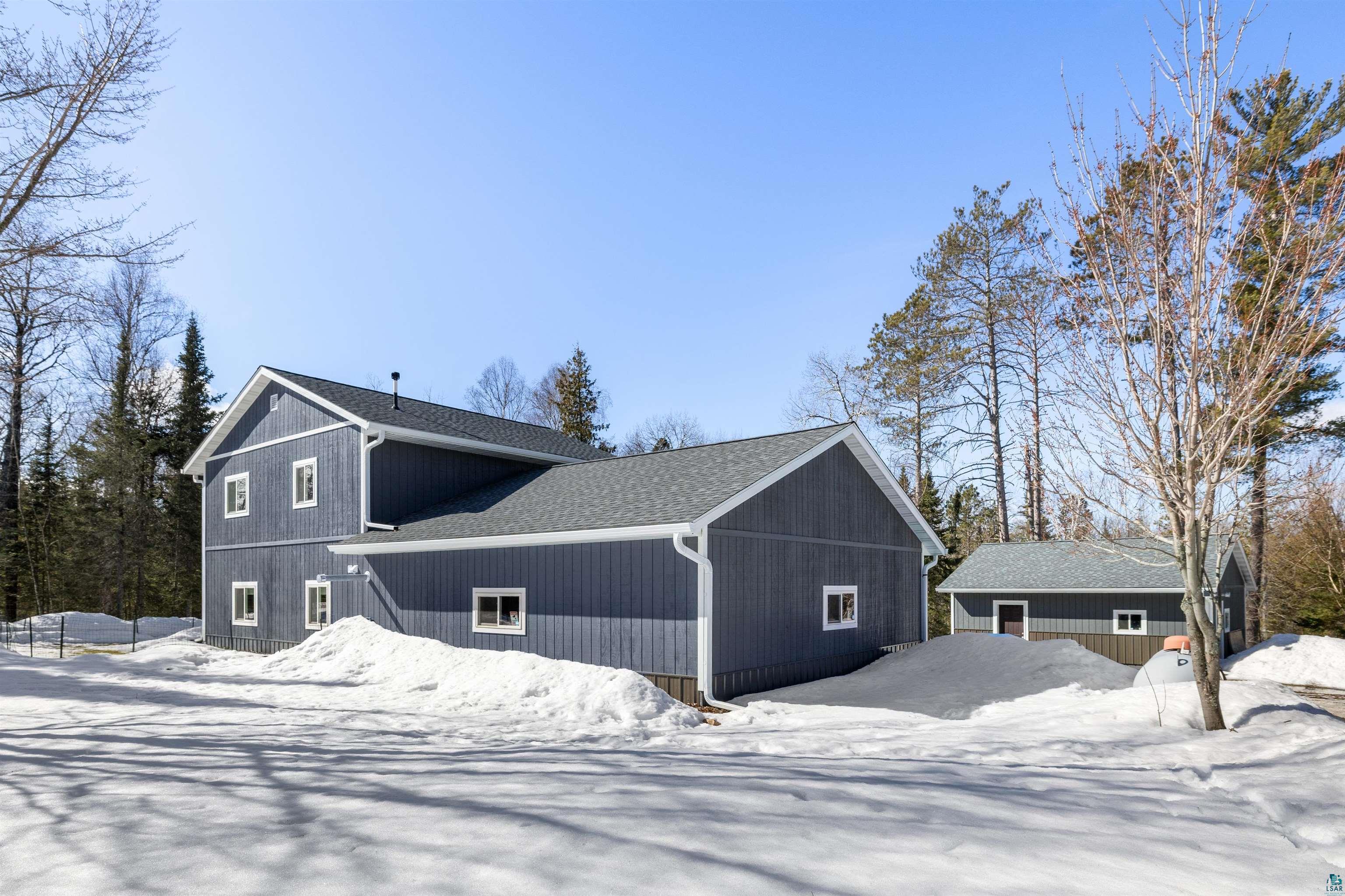 13462 Villa Road Ely, MN 55731 - Photo 29 of 68 Snow covered property featuring roof with shingles