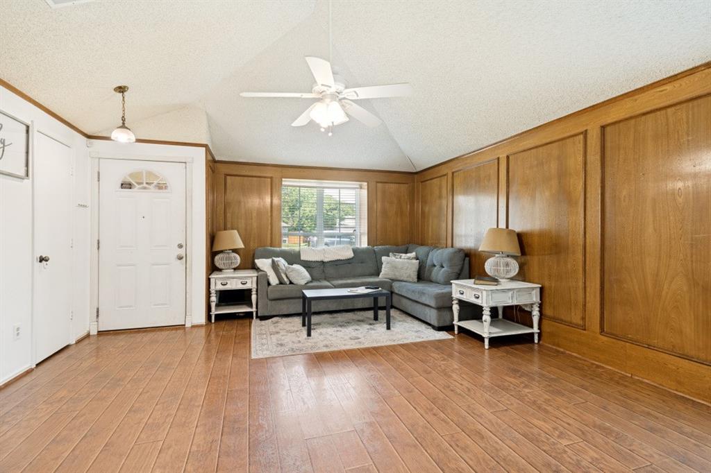 7410 Jessica Way Rowlett, TX 75088 - Photo 5 of 25 a living room with furniture and wooden floor