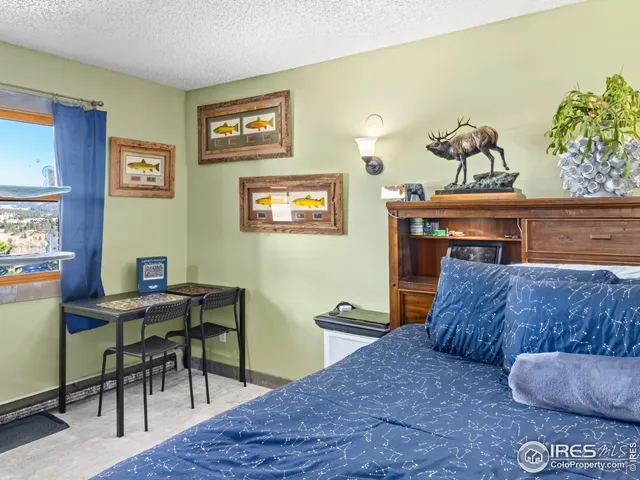 a bed sitting in a bedroom next to a yard