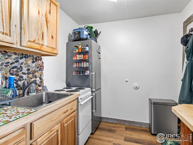 a kitchen with stainless steel appliances granite countertop a stove and a microwave