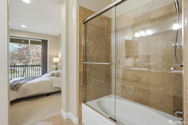 a bathroom with a toilet and a window