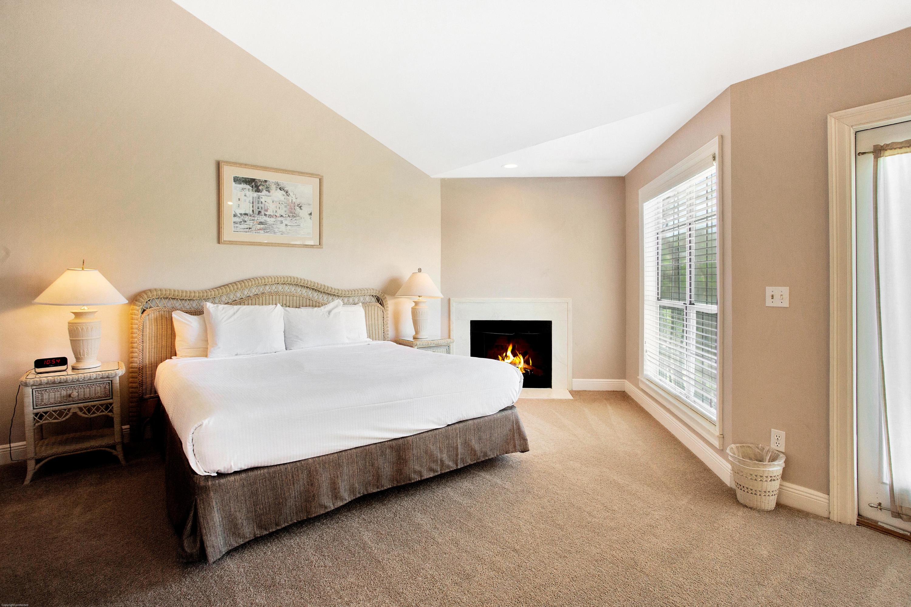 71 Vantage Point Miramar Beach, FL 32550 - Photo 13 of 36 a spacious bedroom with a bed and a fireplace