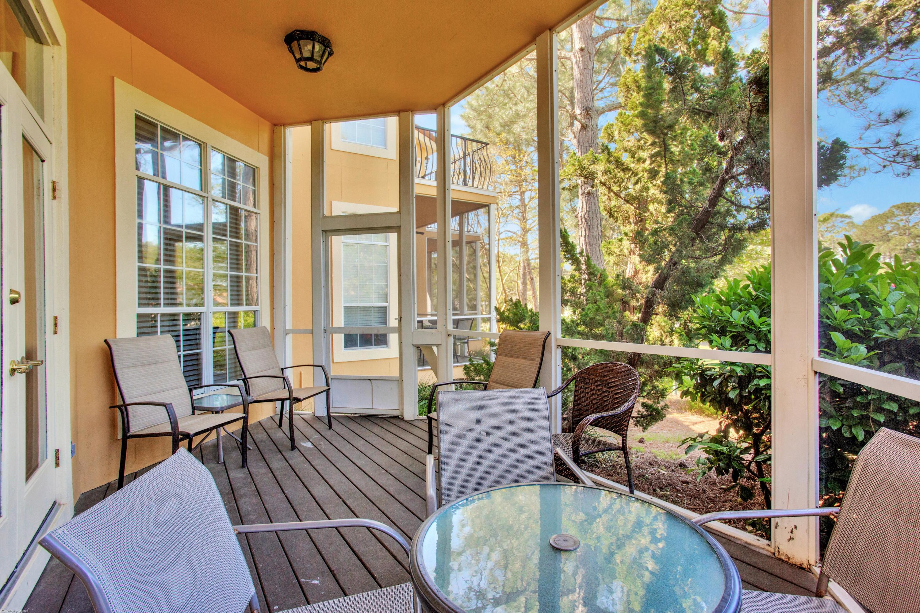 71 Vantage Point Miramar Beach, FL 32550 - Photo 29 of 36 a living room with large windows