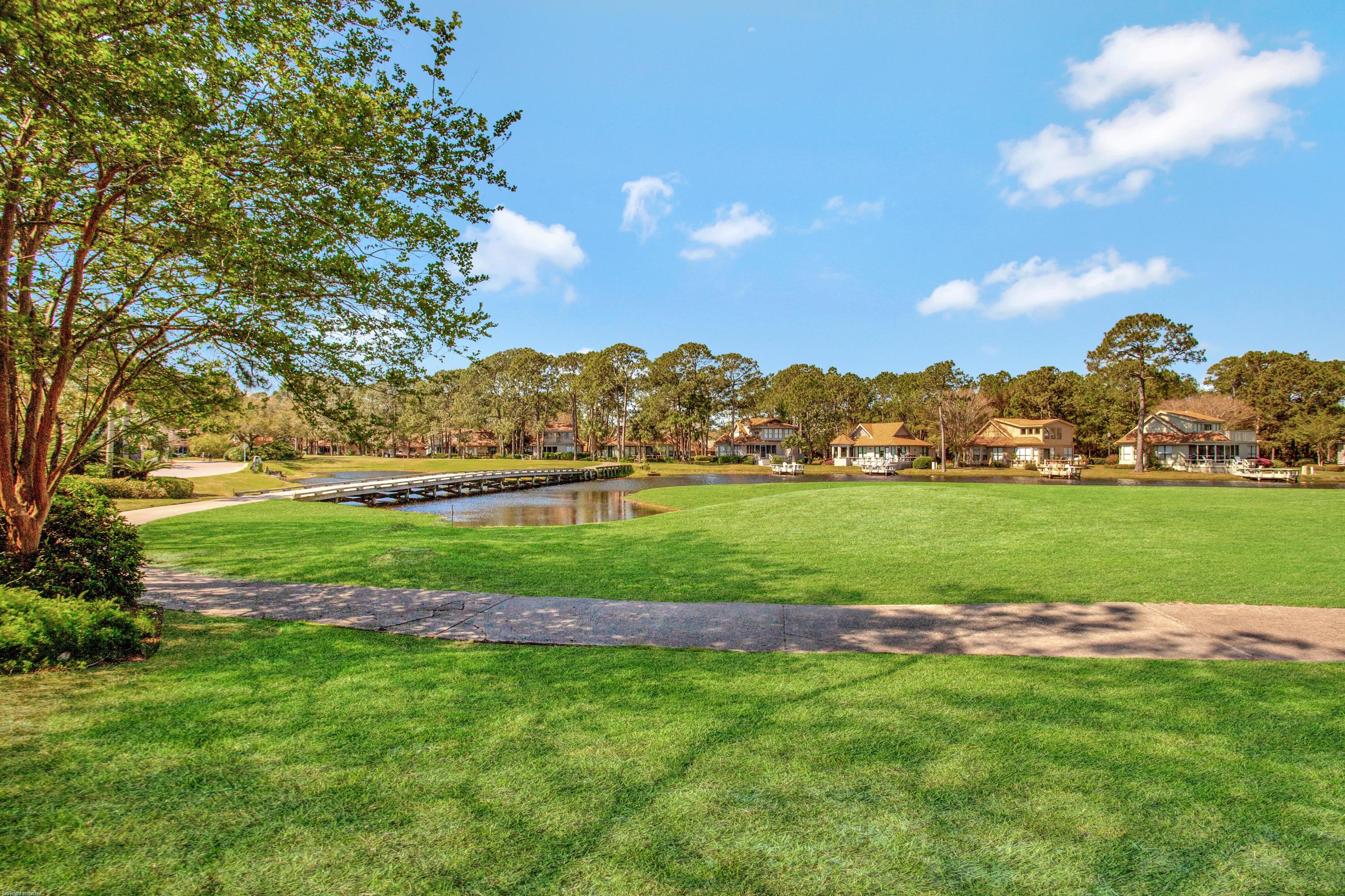 71 Vantage Point Miramar Beach, FL 32550 - Photo 30 of 36 a view of a big yard with a large tree