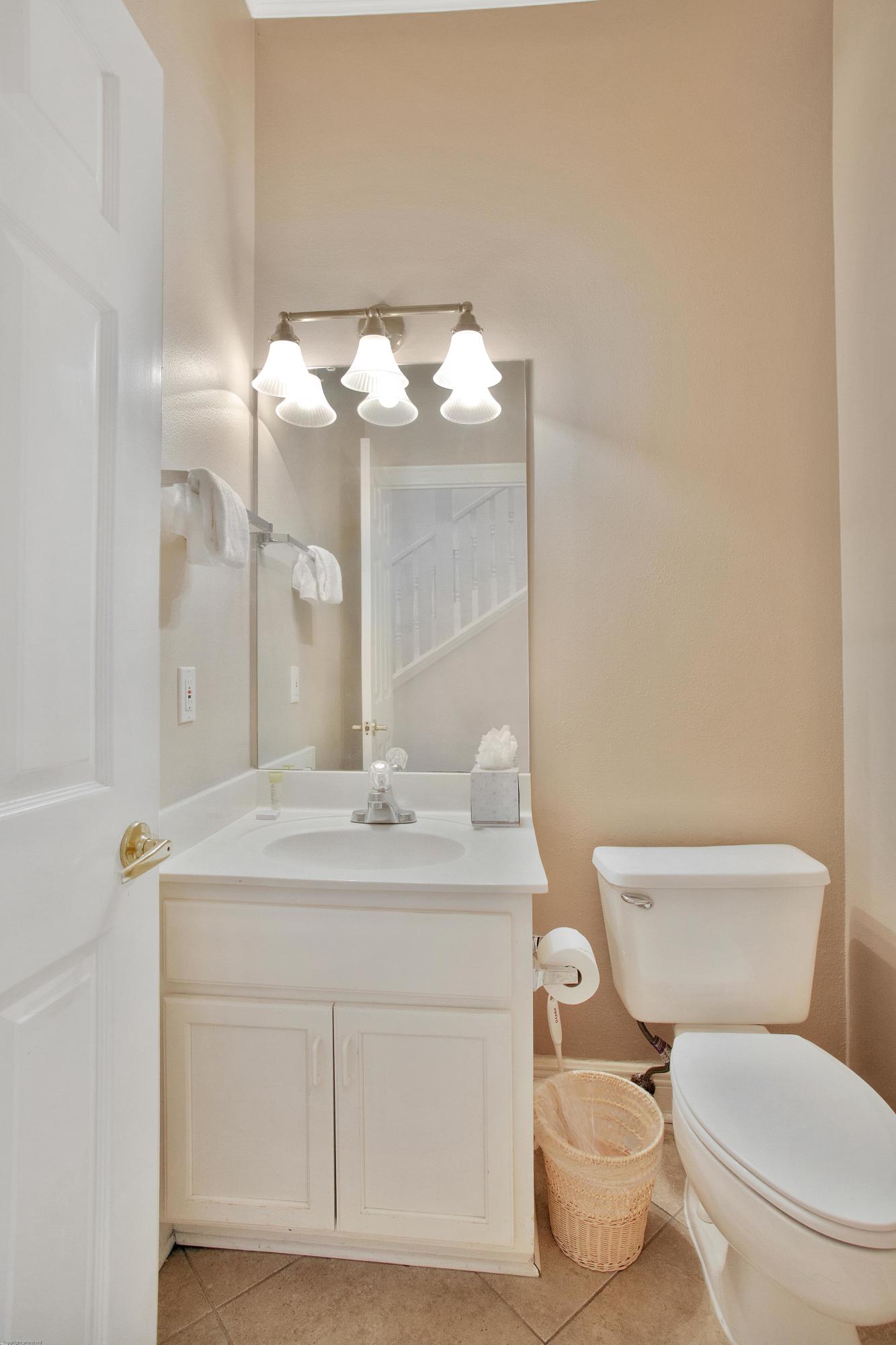 71 Vantage Point Miramar Beach, FL 32550 - Photo 31 of 36 a bathroom with a toilet sink and mirror