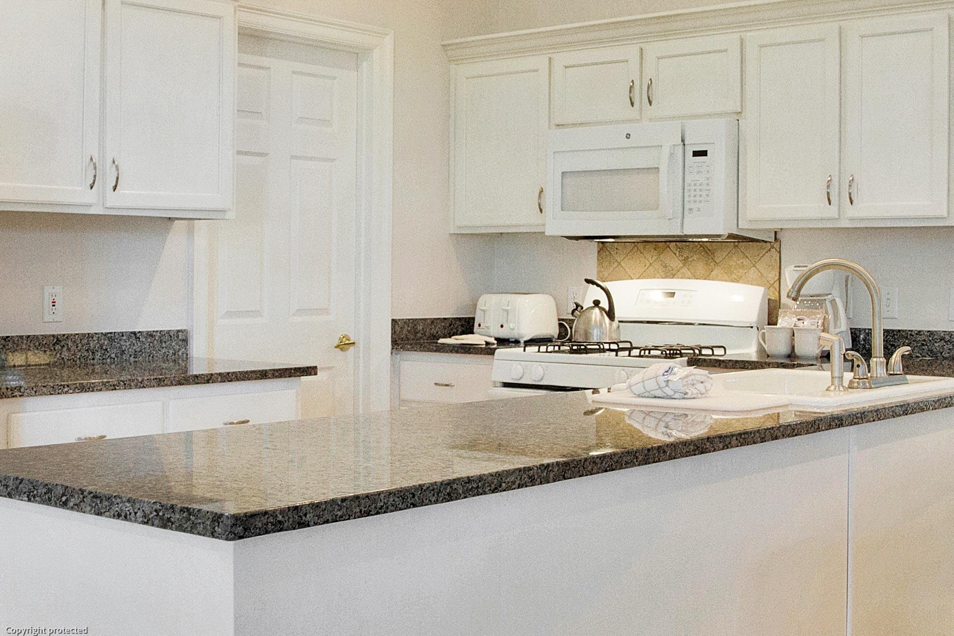 71 Vantage Point Miramar Beach, FL 32550 - Photo 4 of 36 a kitchen with granite countertop a sink a stove and cabinets
