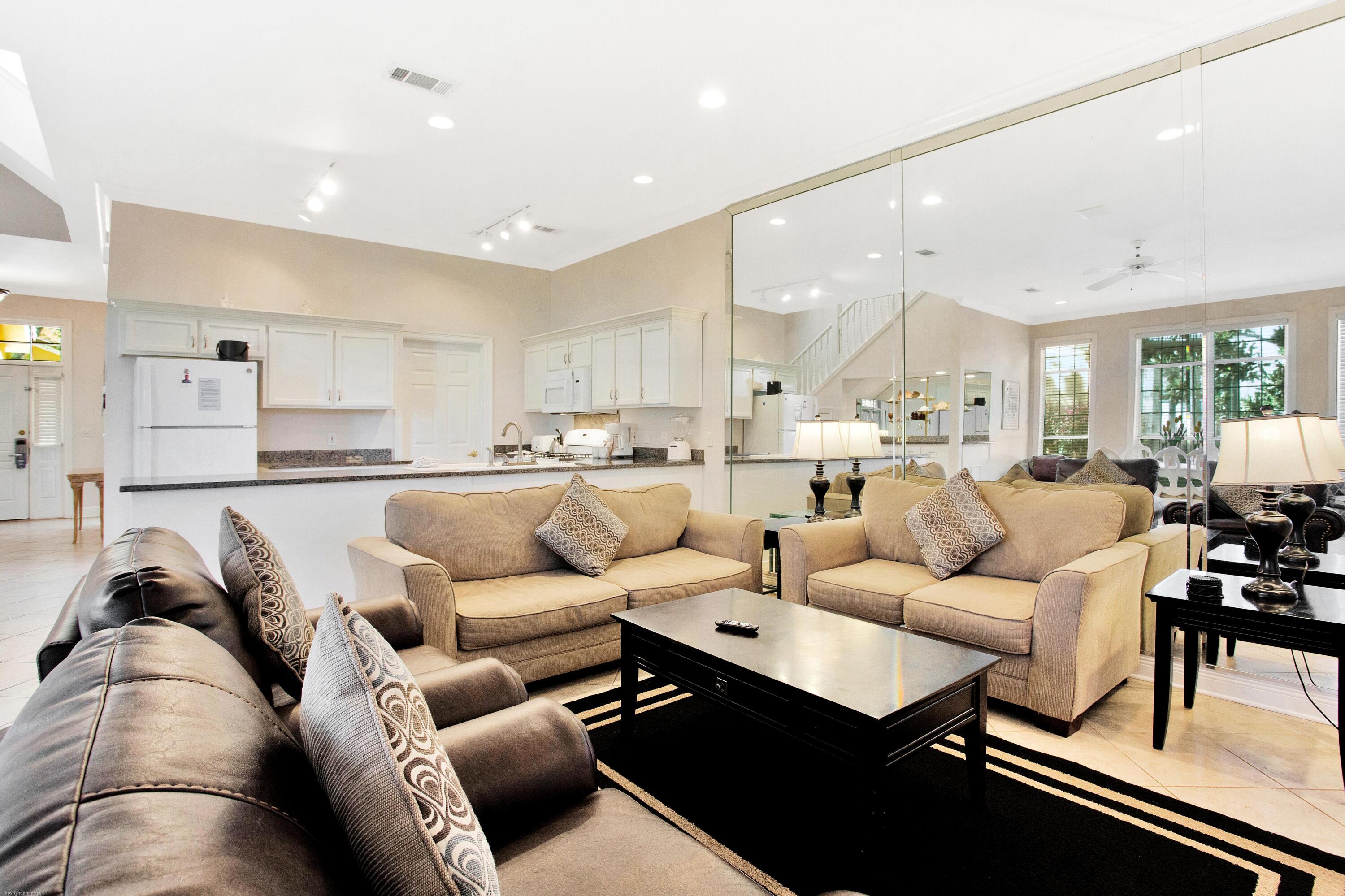 71 Vantage Point Miramar Beach, FL 32550 - Photo 5 of 36 a living room with furniture kitchen view and a wooden floor