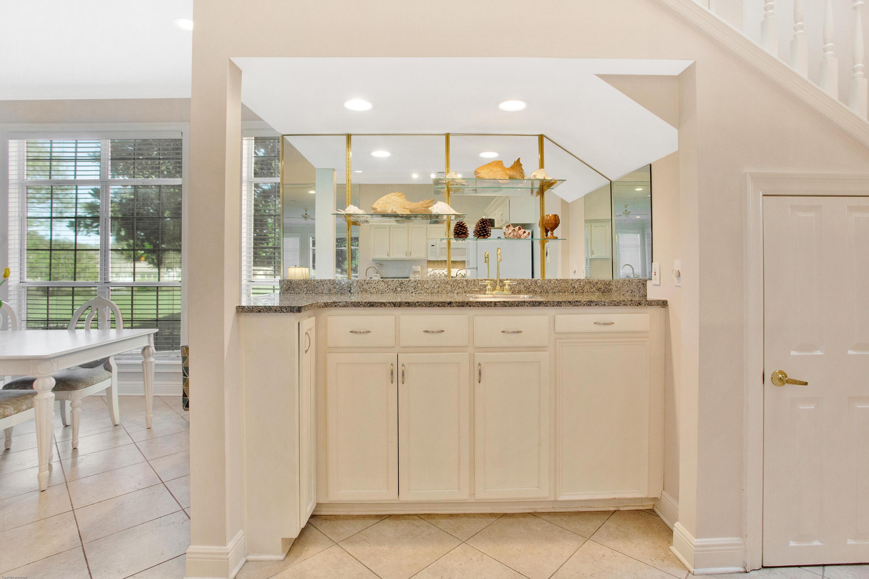 71 Vantage Point Miramar Beach, FL 32550 - Photo 10 of 36 a bathroom with a granite countertop sink and a large mirror